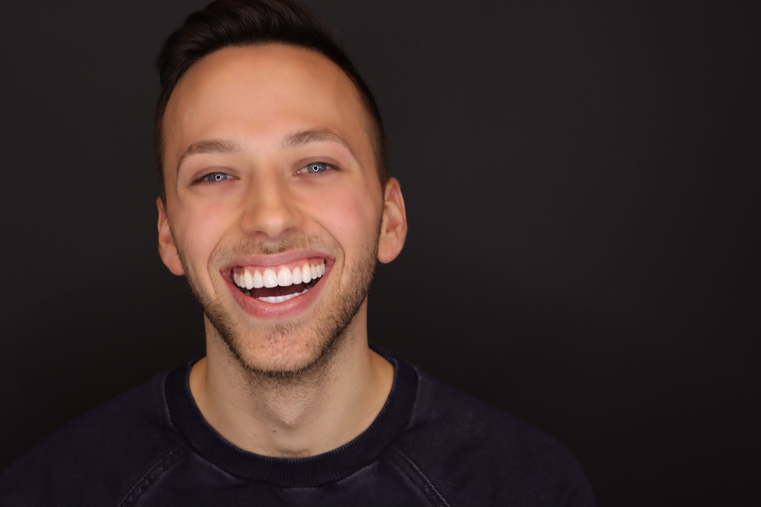 Man with Lite Dentistry work laughing